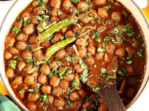 Punjabi chole garnished with ginger and fried chilies