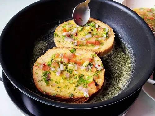 pour egg mixture over the bread