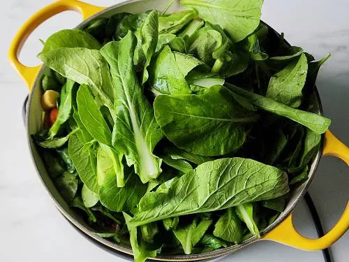 mustard greens in a pan