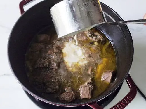 tempered yogurt goes into mutton soup