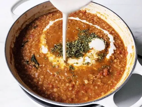 pouring cream and adding kasuri methi