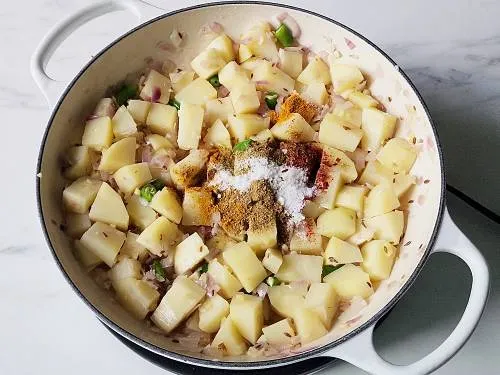 ground spices sprinkle over aloo