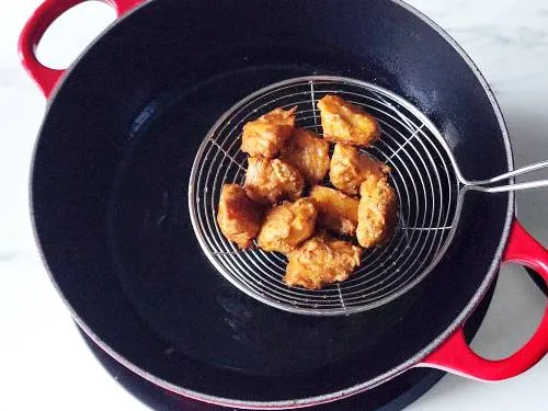 remove fish pakora to a cooling rack