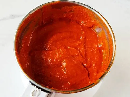 red garlic chutney in a jar to make dabeli