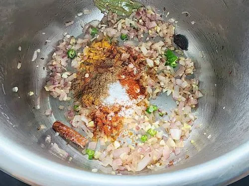 adding spices to the pot