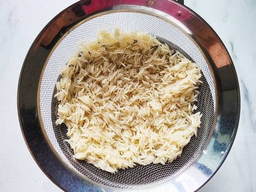 rinsed basmati rice in a colander