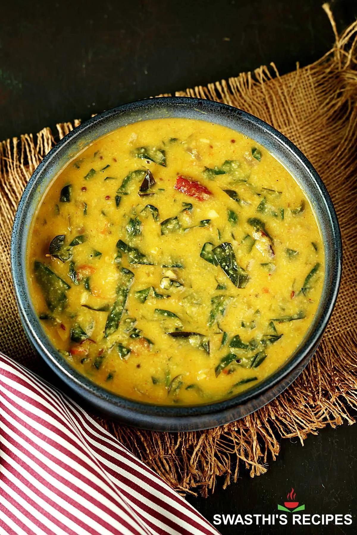 Keerai Kootu also known as spinach kootu served in a blue bowl